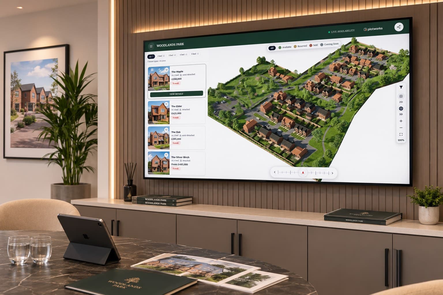 A wall-mounted touchscreen in a marketing suite showing the Woodlands Park siteplan